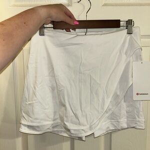 NWT. Lululemon asymmetrical layered HR tennis skirt.